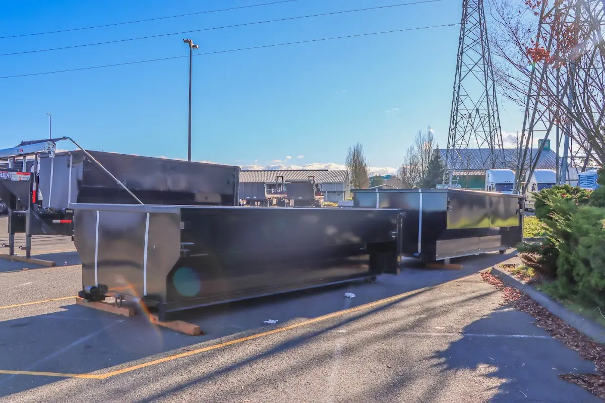 Roll-off dumpster ready for waste disposal at job site for Demolition Dumpster Rental in Newark